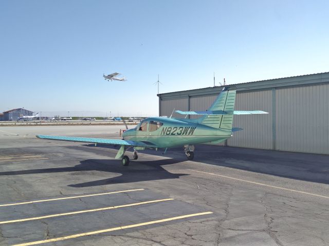 Aero Commander 500 (N823WW) - Standing outside my hangar, she was preparing to depart.