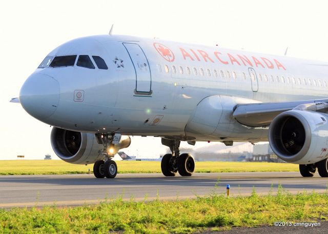 Airbus A319 (C-GAQL) - Awaiting clearance to enter Rwy 25 for an early evening flight to YEG.