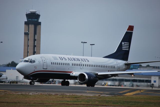 BOEING 737-300 (N574US) - Taxiing into position runway 18L - 10/23/09