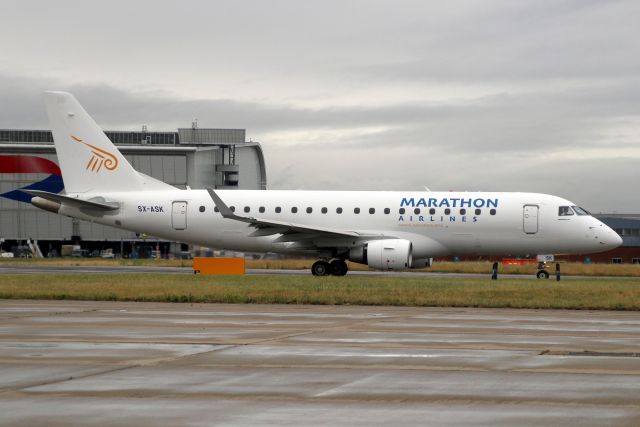Embraer 175 (SX-ASK) - Taxiing to depart rwy 09R on 18-Jun-22 operating Flybe flight BEE974 to EGAC.