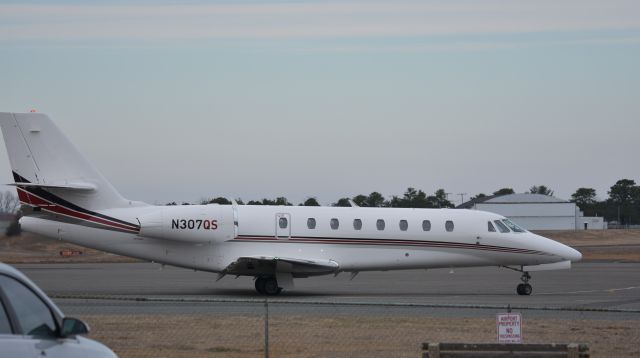 Cessna Citation Sovereign (N307QS) - A NetJjets Cessna Citation Sovereign C680 starts to taxi to runway for departure at Monmouth Airport, NJ Jan. 2021