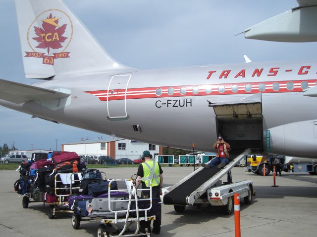 Airbus A319 (C-FZUH) - Air Canada Airbus 319 being loaded for the non-stop mid-day flight from Fort McMurray, Alberta, Canada to Toronto Pearson International Airport. Aircraft is painted in Trans Canada Airlines livery in honour of the 60th anniversary of the airline.