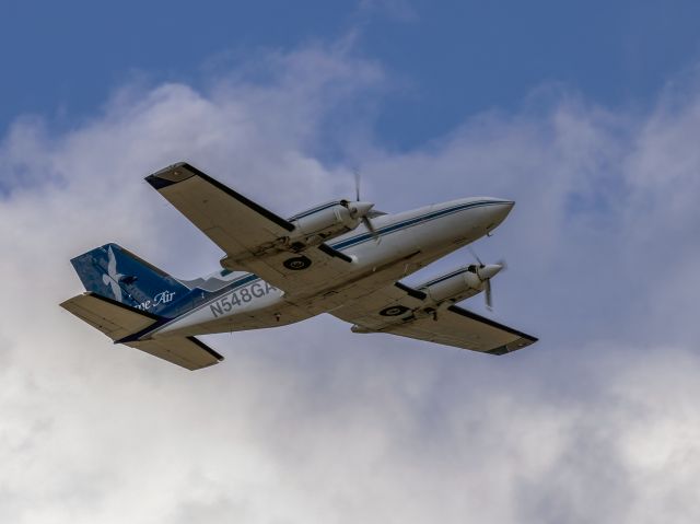 Cessna 402 (N548GA) - Take off 22R. Canon 600mm lens. 08-AUG-2022.