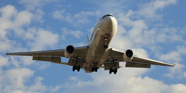 McDonnell Douglas DC-10 (N304FE) - This spotting location provides a "Maho Beach-style" thrill because the aircraft landing on RTIAs runway 16R pass overhead so low.  This click captured FDXs N304FE completing the first half of the daily morning KMEM-KRNO-KMEM round trip.  