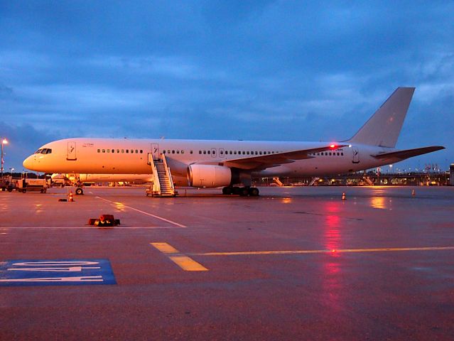 Boeing 757-200 (G-POWH) - Small 25 Years Titan on the left side of the door