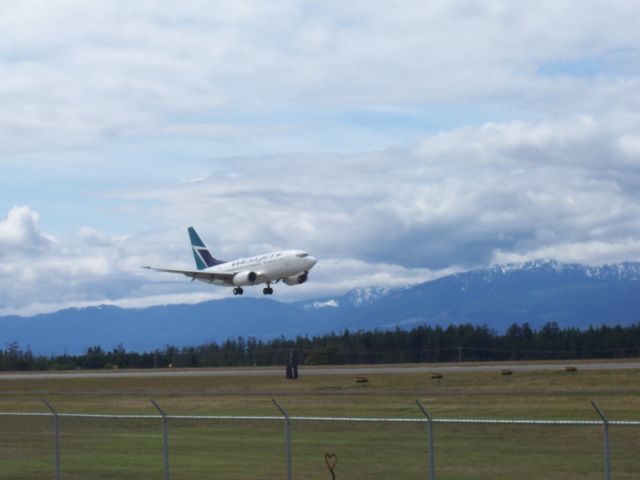 — — - West Jet Commercial jet on landing approach CFB Comox