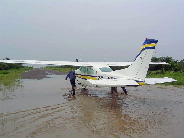 Cessna Centurion (ZS-AVB) - At Impalila IS=sland, Namibia after haevy rain falls overnight.