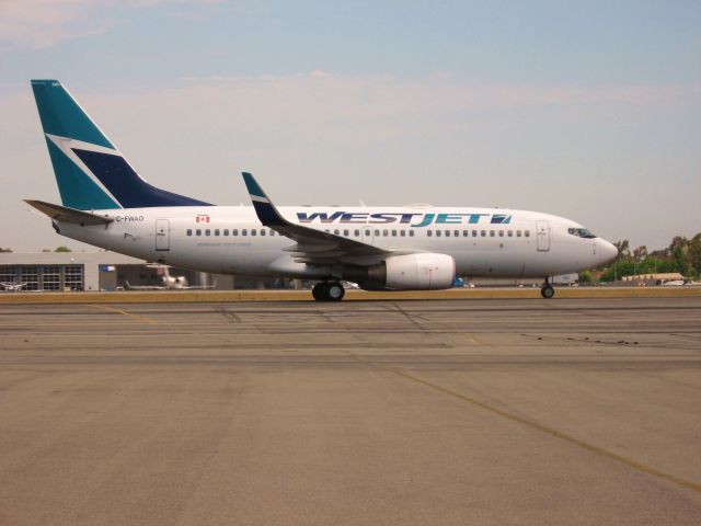 Boeing 737-700 (C-FWAO) - TAXIING TO GATE AFTER LANDING