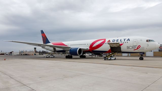 BOEING 767-400 (N845MH) - A Delta 767-400 wearing the Breast cancer Research Foundation Livery, sits on the ramp at Corporate Wings.