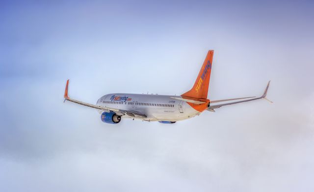 Boeing 737-700 (C-FTOH) - You cant go wrong with this livery against a blue sky! Taken from Creamery Rd.