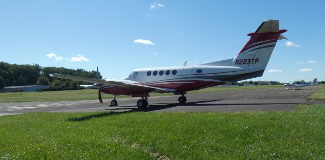 Beechcraft Super King Air 200 (N223TP) - Catching some tarmac time is this 1983 Beechcraft Super King Air 200 in the Autumn of 2021.