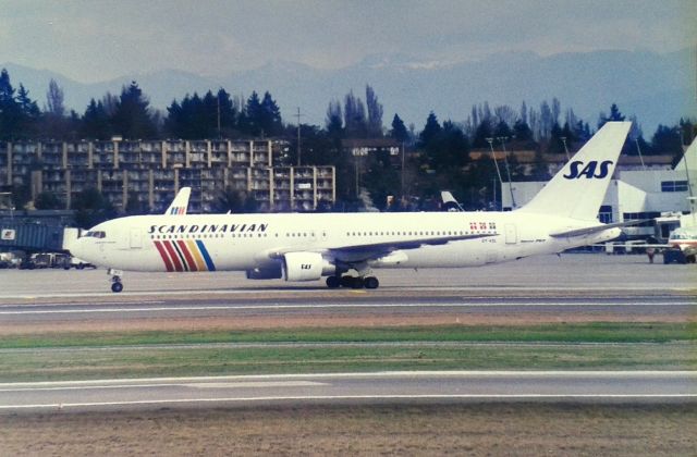 BOEING 767-300 (OY-KDL) - KSEA - Globe trotting 767-3 idles to the departure runways at Seattle - this was my 1st SAS-Scandinavian 767 photo and taken from the now closed Airpark. Feb 1995.