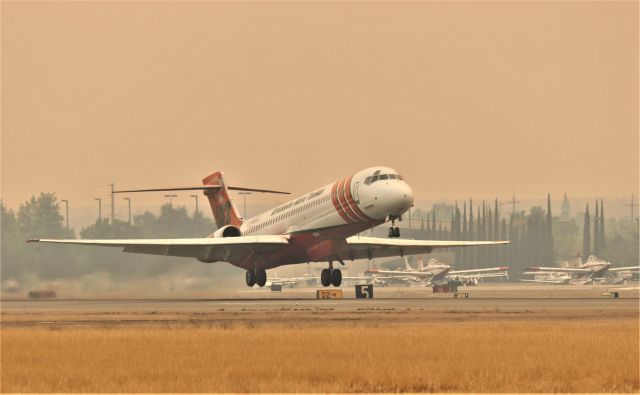 McDonnell Douglas MD-87 (N292EA) - KRDD Sept 29 2020 Erickson Aero Tanker 102 departing for the ZOGG Fire burning west of Redding CA USA The northern CA area was covered in smoke like this for most of 3 months this year 2020.