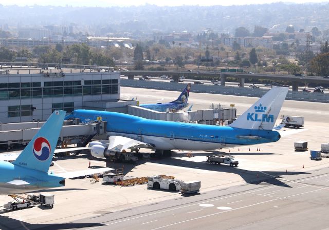 Boeing 747-400 (PH-BFH) - KSFO - Nice to see a 747-4 at San Francisco - KLM sitting pretty at the Intl Terminal. The Westjet Disney Special is C-GWSV on the gate - and if youre ever in the SFO area, drive to the top floor of the parking structure in the distance and watch jets from there, free parking Millbrae BART station. The photography from there sucks because of tower transmission power lines, but great for watching and scanner traffic. Oct 14th, 2018.