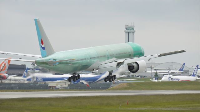 BOEING 777-300 (HL8250) - BOE955 nears touchdown to runway 16R and completion its maiden flight on 6/4/12. (LN:1023 c/n 37650).