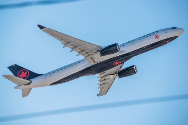 Airbus A330-300 (C-GEFA) - Read between the lines... Notice a small wake vortex off of her wingtips.