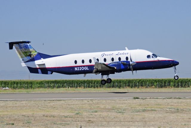 Beechcraft 1900 (N220GL) - GLA Beechcraft 1900 landing runway three-zero, Merced Regional Airport, KMCE