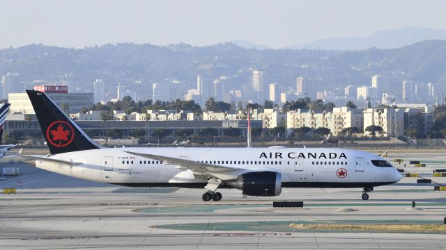 Boeing 787-8 (C-GHPQ) - Taxiing to gate at LAX on taxiway Bravo