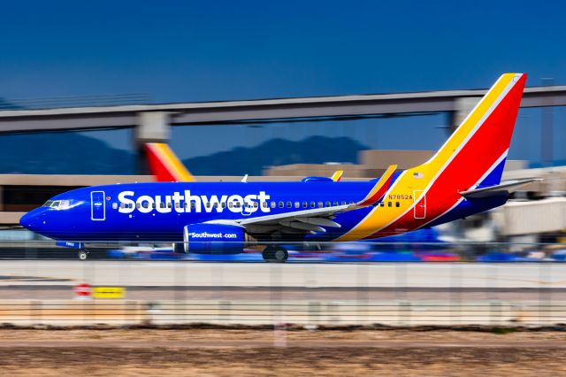Boeing 737-700 (N7852A) - A Southwest Airlines 737-700 taking off from PHX on 2/23/23. Taken with a Canon R7 and Canon 100-400 EF ii lens.