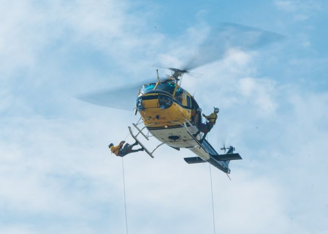 Bell UH-1V Iroquois (N28X) - Whenever my office starts shaking, I always find an excuse to go take a little walk to see why. Today, it was USFS firefighters training over the grass south of our hangar.