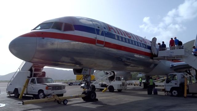 Boeing 757-200 (N678AN) - N678AN sits at gate 7 at STT as passengers board for their flight to CLT!