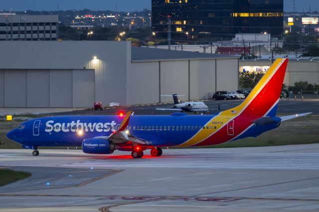 Boeing 737-800 (N8693A) - Handheld shot at 1/10 shutter, runway 4 departure