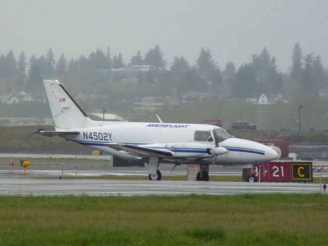 Piper Navajo (N4502Y) - Jusat waiting in the rain.