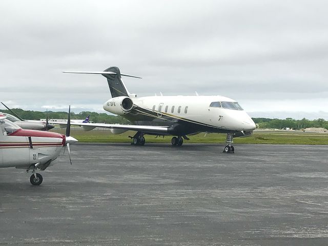 Bombardier Challenger 300 (N575FX) - On the MAC Jets FBO ramp, Portland, Maine, Jun. 2022