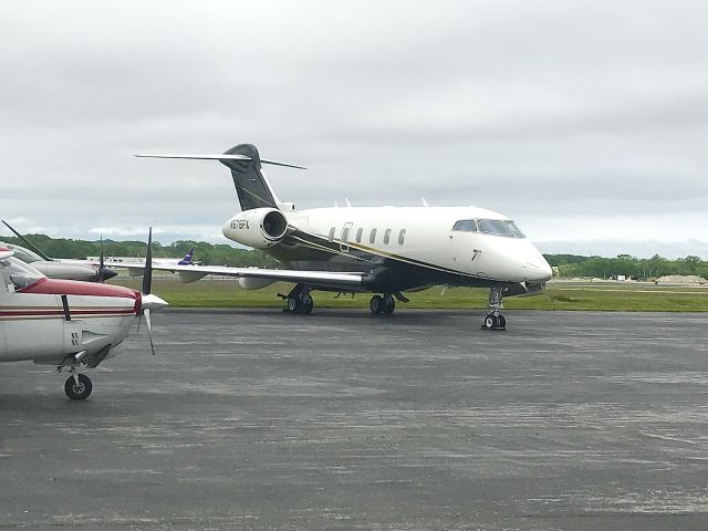 Bombardier Challenger 300 (N575FX) - On the MAC Jets FBO ramp, Portland, Maine, Jun. 2022