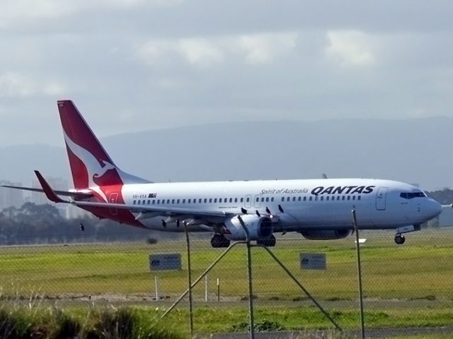 Boeing 737-800 (VH-VXA) - On taxi-way heading for take off on runway 05.