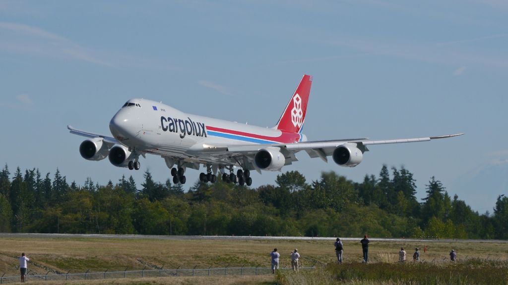 BOEING 747-8 (LX-VCM) - BOE513 on short final to Rwy 34L to complete a flight test on 8.25.15. (ln 1522 / cn 61169). Note the other spotters getting their shots of the aircraft. 