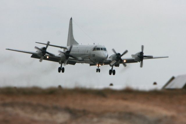 — — - P-3C Orion doing touch and gos at the Hickory Airport on 3-28-2008 at 18:19