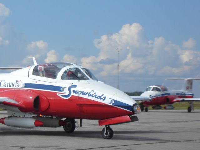 — — - Members of the Canadian Forces Snowbirds demonstration squadron taxiing to the main apron at Fort McMurray, ALberta, Canada on a fuel stop over, July 2008