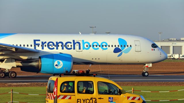 Airbus A350-900 (F-HREU) - Seen from"Coulée verte".The DGAC vehicle in runway surveillance.