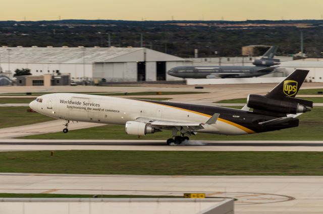 Boeing MD-11 (N252UP) - Arriving 31L with a KC-10 in the background.