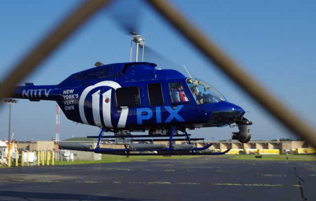 Bell JetRanger (N11TV) - LINDEN AIRPORT-LINDEN, NEW JERSEY, USA-AUGUST 29, 2018: A news helicopter from one of the local New York City T.V. stations is pictured after refueling.