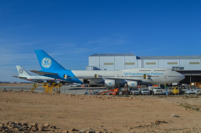 Boeing 747-200 (N747GE) - 2 GE 747s that are used to test new aircraft engines. Note the 747 in the rear with the old GE paint scheme. SCLA Victorville CA