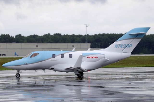 Honda HondaJet (N143RP) - HA-420 HondaJet Elite, N143RP, seen at KTOL on a rainy Sunday, 2 Aug 2020. 