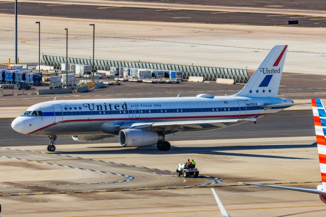 Airbus A320 (N475UA) - A United Airlines A320 in Friend Ship retro livery taxiing at PHX on 2/11/23 during the Super Bowl rush. Taken with a Canon R7 and Canon EF 100-400 II L lens.