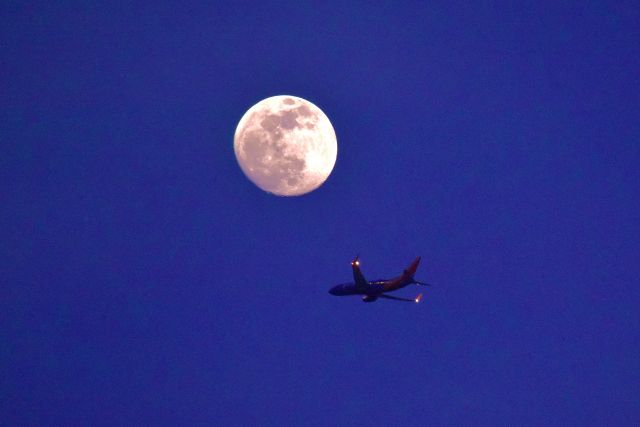 Boeing 737-700 — - Departing KLAS beneath a full moon for KDAL