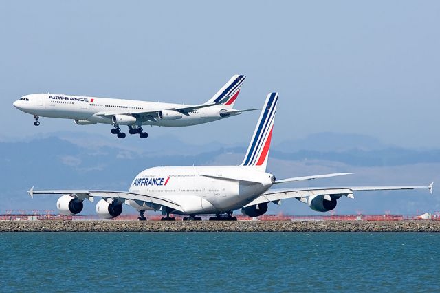 Airbus A380-800 (F-HPJA) - Air France Airbus A340-313X F-GLZP lands as Air France Airbus A380-861 F-HPJA waits