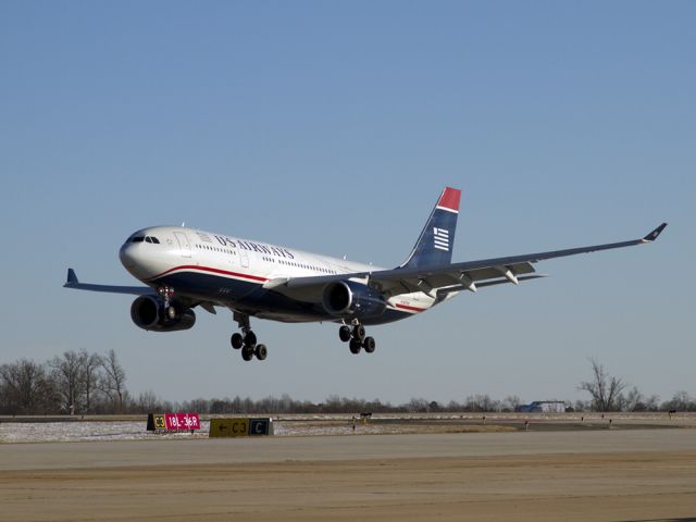 Airbus A330-200 (N279AY) - Flight 704 arrives at Charlotte, North Carolina USA from Frankfurt, Germany on Monday, 27 December 2010. Evidence of the "crippling blizzard" of December 25-26 can be seen on the ground. This airplane will depart from Charlotte at 8:05 pm as Flight 705, back to Frankfurt.