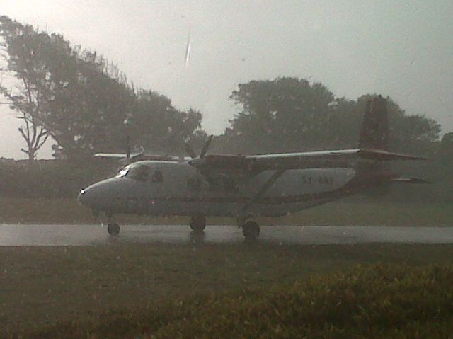 HARBIN Y-12 (SCX9) - My flight came in to pick me up earlier in the afternoon.  Wind was light with some rain.  The flight out the previous day had been cancelled due to poor weather conditions.  She made it in and within 10 minutes I was airborne and bound for Mahe via the island of Ile Platte.