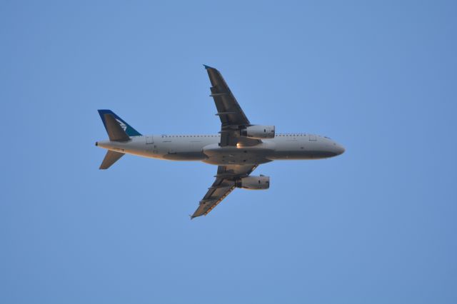 Airbus A320 (ZK-OJO) - Flight ANZ704 from Sydney, at an altitude of about 4,000 feet over One Tree Hill on 6 June 2015 at 4:37pm. At start of final turn for recently implemented short approach to runway 23L at Auckland Airport.