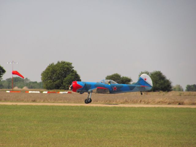 — — - Unique plane taking off at Great Bend during a fly in.