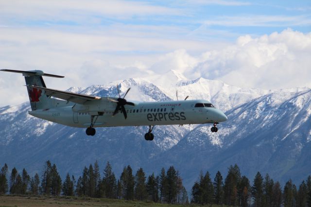 C-GJZX — - Q400 landing against the famous Rocky Mountains