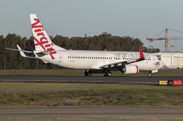 Boeing 737-800 (VH-VOL) - Entering runway One-Niner via Alpha 3