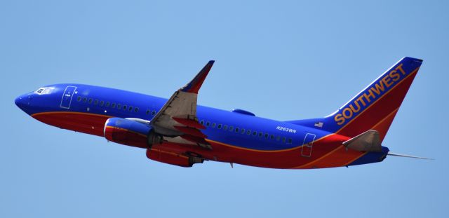 Boeing 737-700 (N263WN) - Taken from the top of the RDU parking deck, 4/12/18.