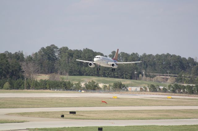 Airbus A319 (N826AW) - N826AW over the numbers for runway 23R