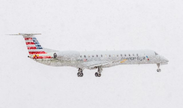 Embraer ERJ-145 (N611AE) - Almost zero visibility, American Eagle on short finals for runway 23